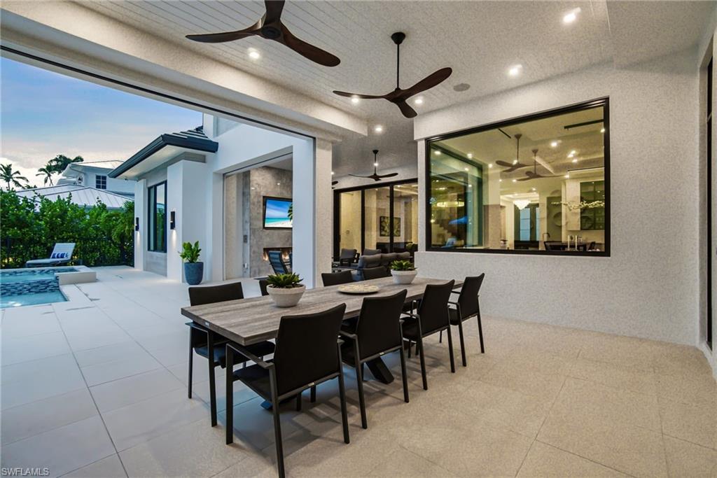 264 8th Avenue South Naples, FL 34102 - Photo 33 of 40 a view of a dining room with furniture