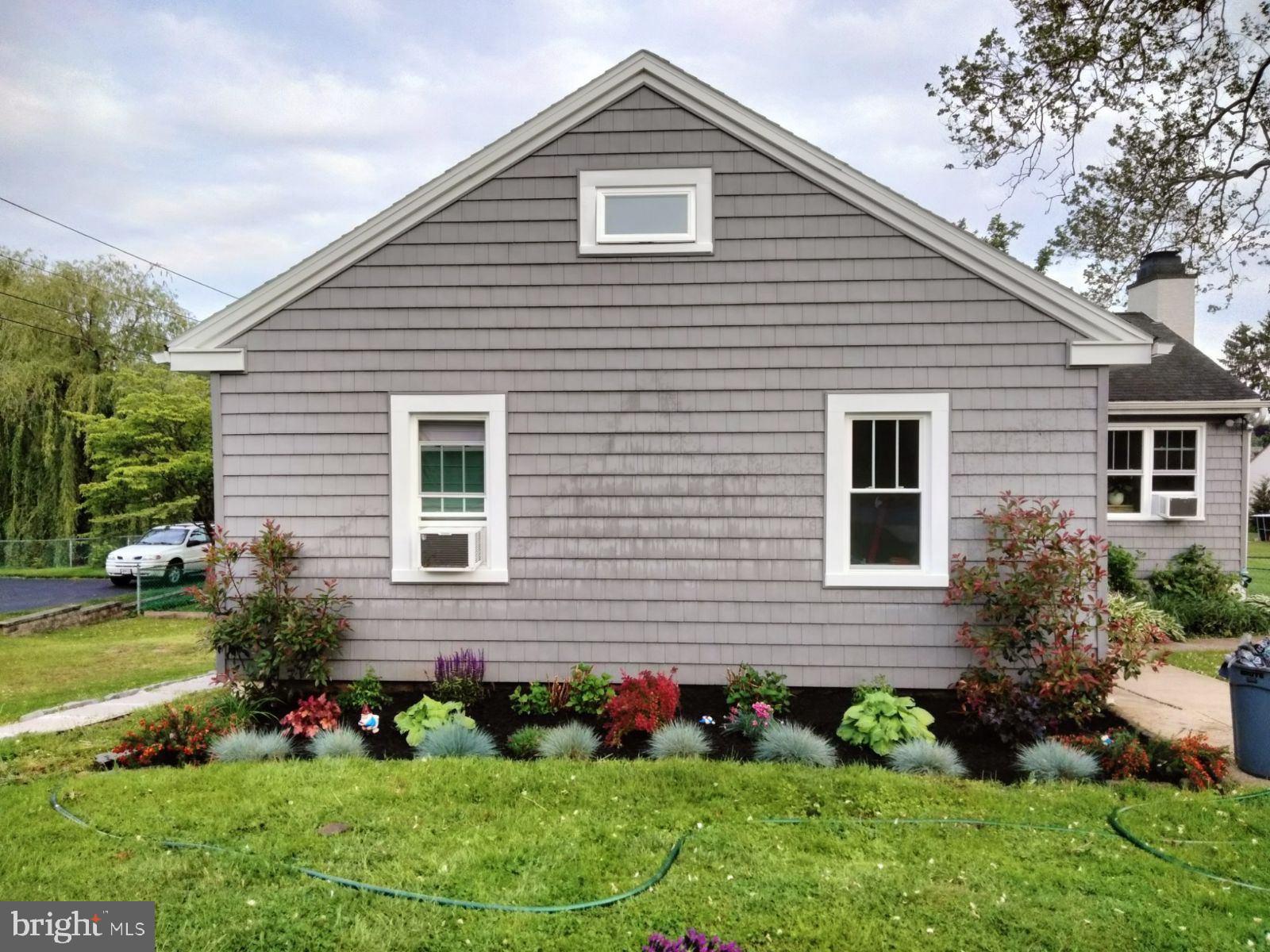 1245 Center Road Havertown, PA 19083 - Photo 4 of 38 a front view of house with yard and green space