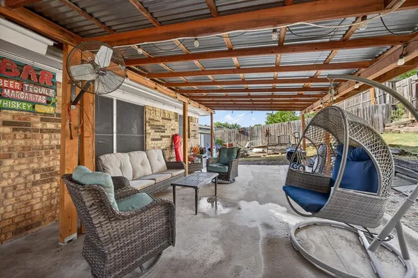 a view of a porch with furniture