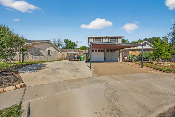 a view of a house with a outdoor space and sitting area