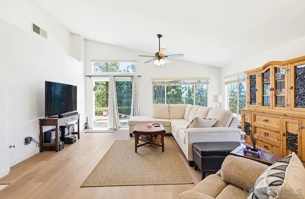2501 Columbine Road Alpine, CA 91901 - Photo 5 of 44 a living room with furniture a flat screen tv and a large window