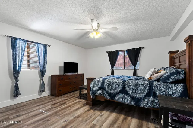 a view of workspace with wooden floor windows