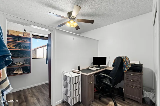 a view of walk in closet with clothes