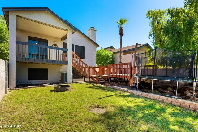 a view of a house with a yard patio and a patio