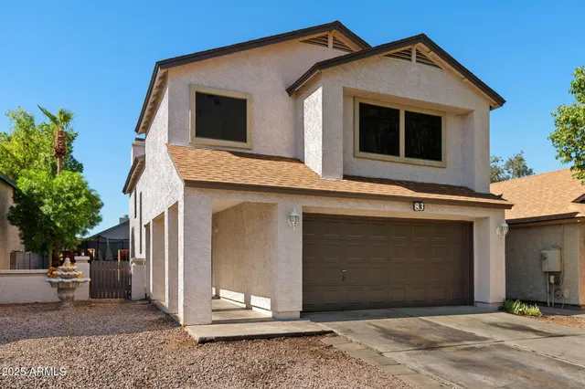 a living room with furniture a ceiling fan and a rug