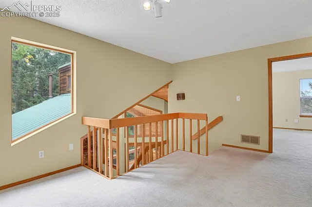 a view of a room with a hallway