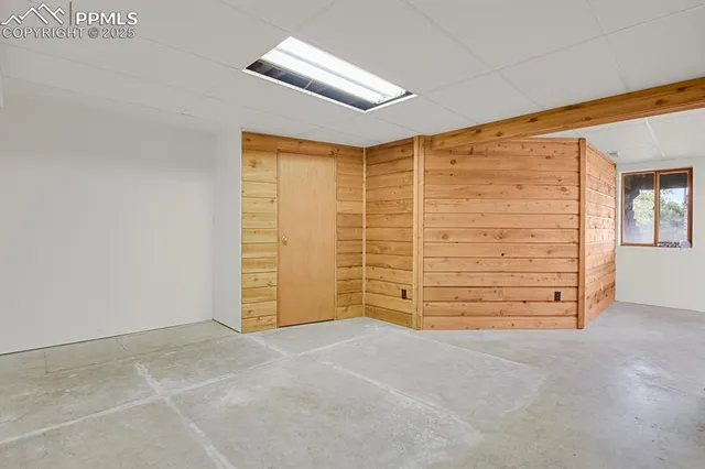 a view of room with walk in closet and window
