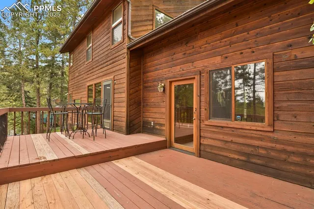 a view of balcony with wooden floor and fence