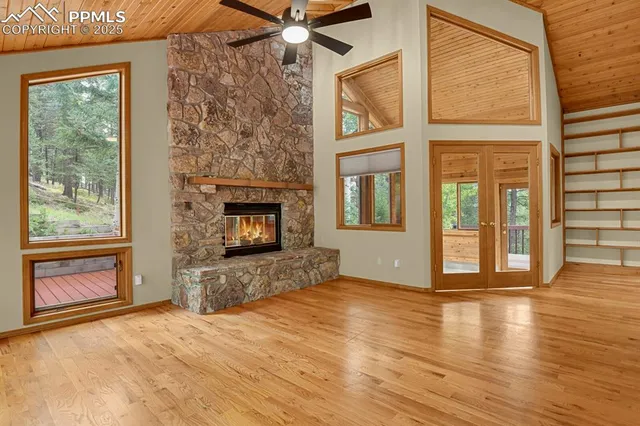 a view of an entryway with wooden floor and door