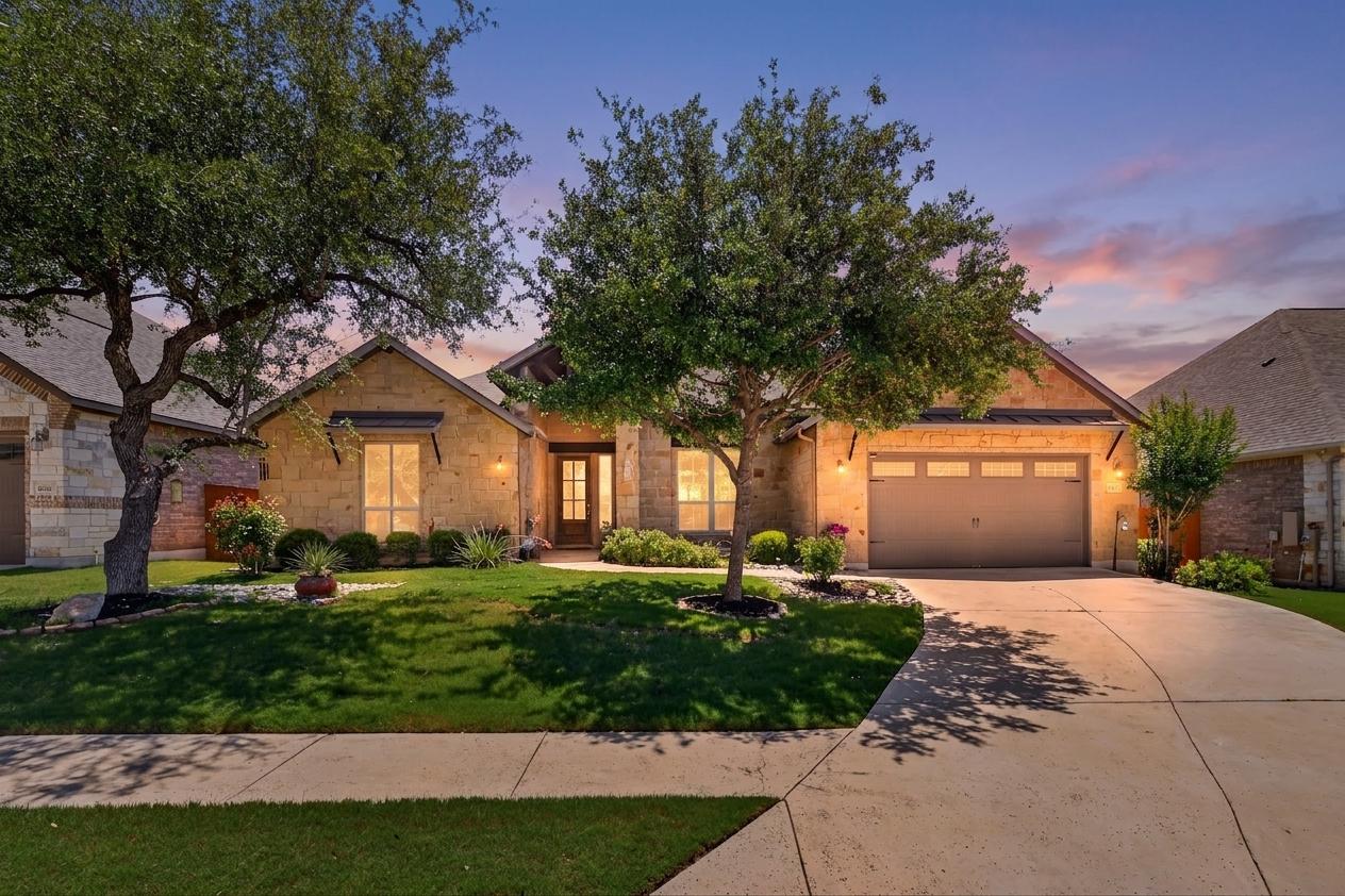 4105 Haight Street Round Rock, TX 78681 - Photo 1 of 40 a front view of a house with a garden and trees