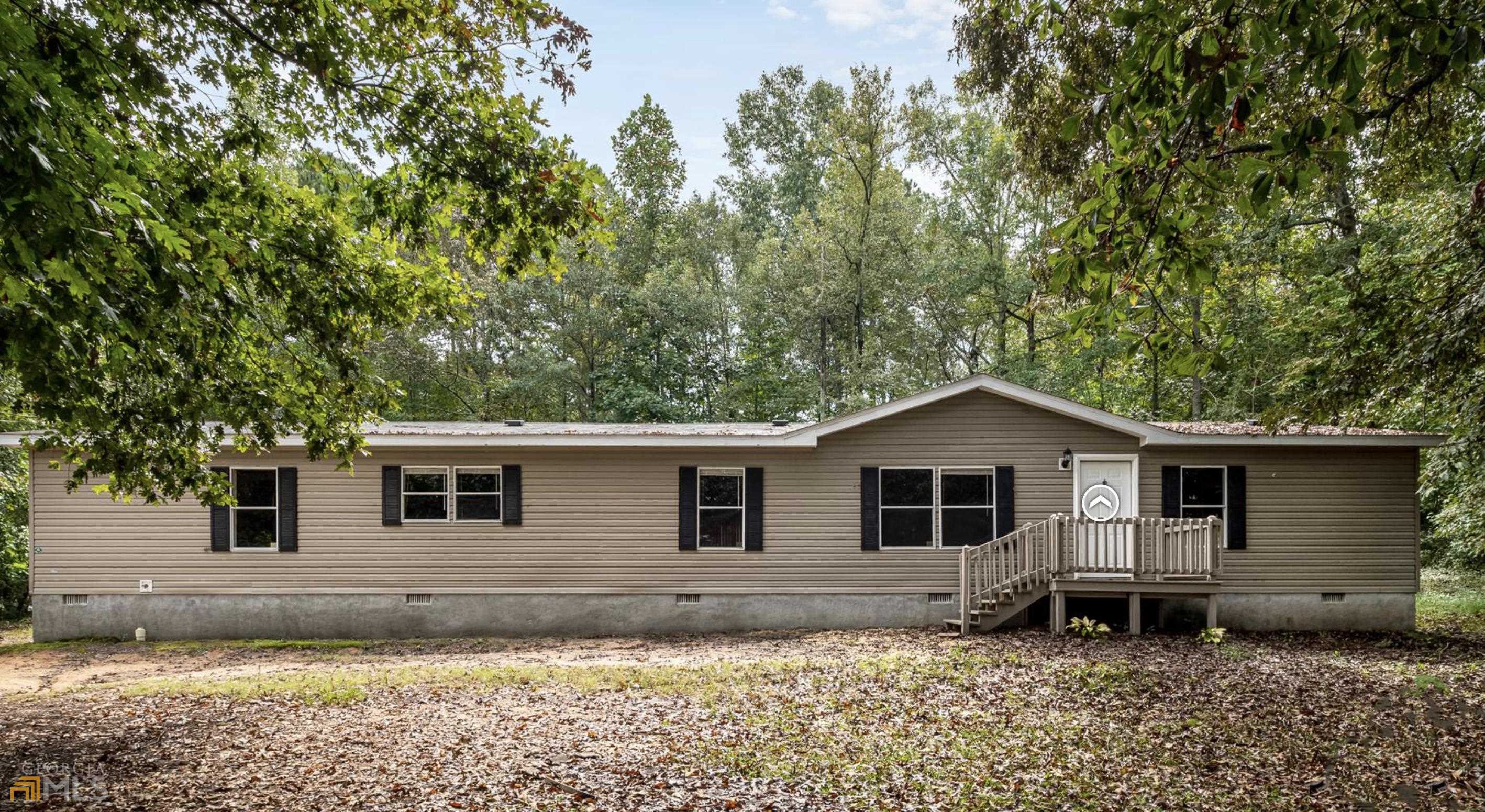 208 Reeves Road Jackson, GA 30233 - Photo 1 of 1 a house view with a backyard space