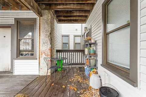 a balcony view with a outdoor seating space