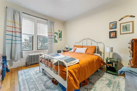 a bedroom with a bed and a table