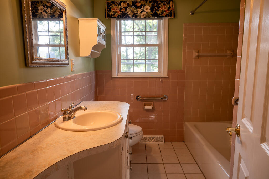 76 Longfellow Drive Centerville, MA 02632 - Photo 11 of 18 a bathroom with a sink a toilet and tub