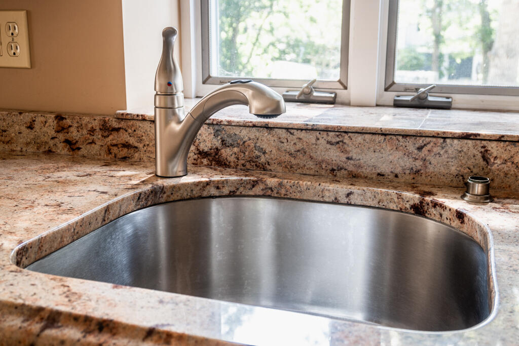 76 Longfellow Drive Centerville, MA 02632 - Photo 5 of 18 a view of a kitchen counter top a stove and a window