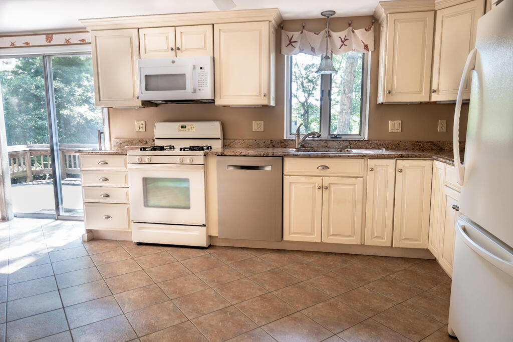 76 Longfellow Drive Centerville, MA 02632 - Photo 6 of 18 a kitchen with appliances cabinets and a sink