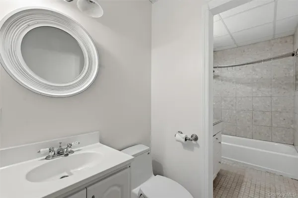 a bathroom with a sink a toilet and a bathtub