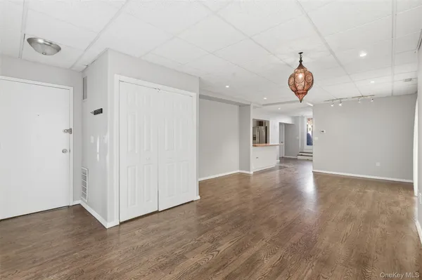 a view of a livingroom with wooden floor