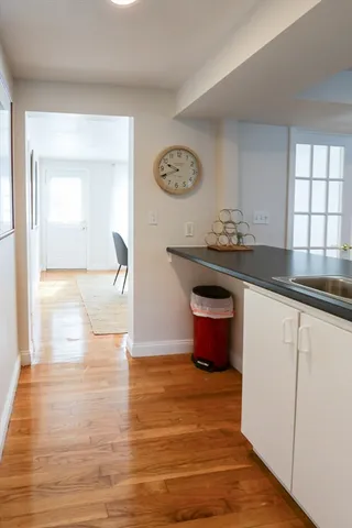 a view of a kitchen cabinets and wooden floor