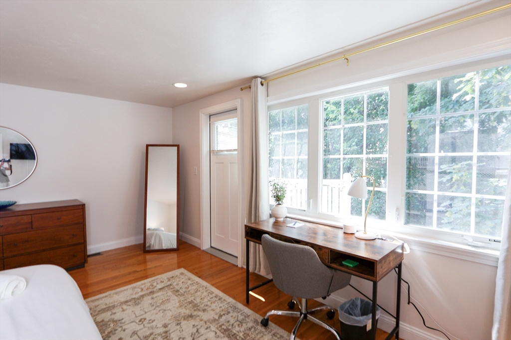 25 Jay Street, Unit FURNISHED Cambridge, MA 02139 - Photo 19 of 28 a workspace with furniture and a window