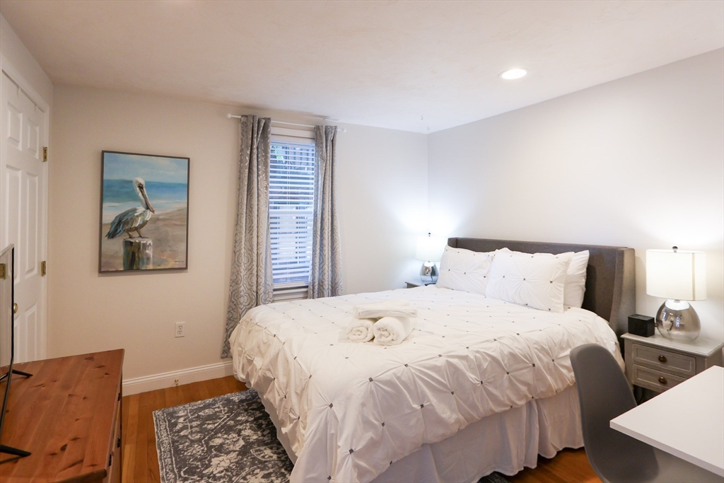 25 Jay Street, Unit FURNISHED Cambridge, MA 02139 - Photo 20 of 28 a bedroom with double bed and a window