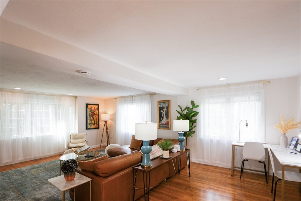 25 Jay Street, Unit FURNISHED Cambridge, MA 02139 - Photo 2 of 28 a living room with furniture and wooden floor