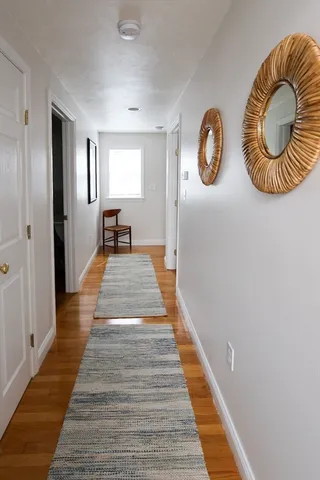 a bathroom with a toilet a sink and a mirror