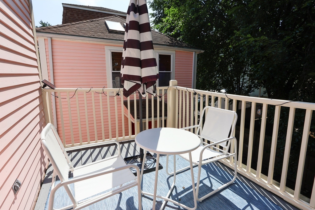 25 Jay Street, Unit FURNISHED Cambridge, MA 02139 - Photo 26 of 28 a view of balcony with wooden floor and outdoor seating