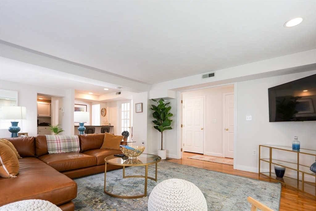 25 Jay Street, Unit FURNISHED Cambridge, MA 02139 - Photo 3 of 28 a living room with furniture and a flat screen tv