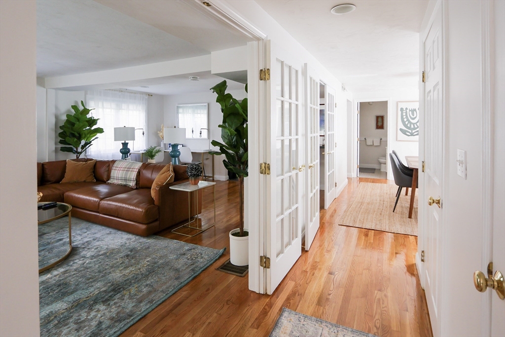 25 Jay Street, Unit FURNISHED Cambridge, MA 02139 - Photo 4 of 28 a living room with furniture and a wooden floor
