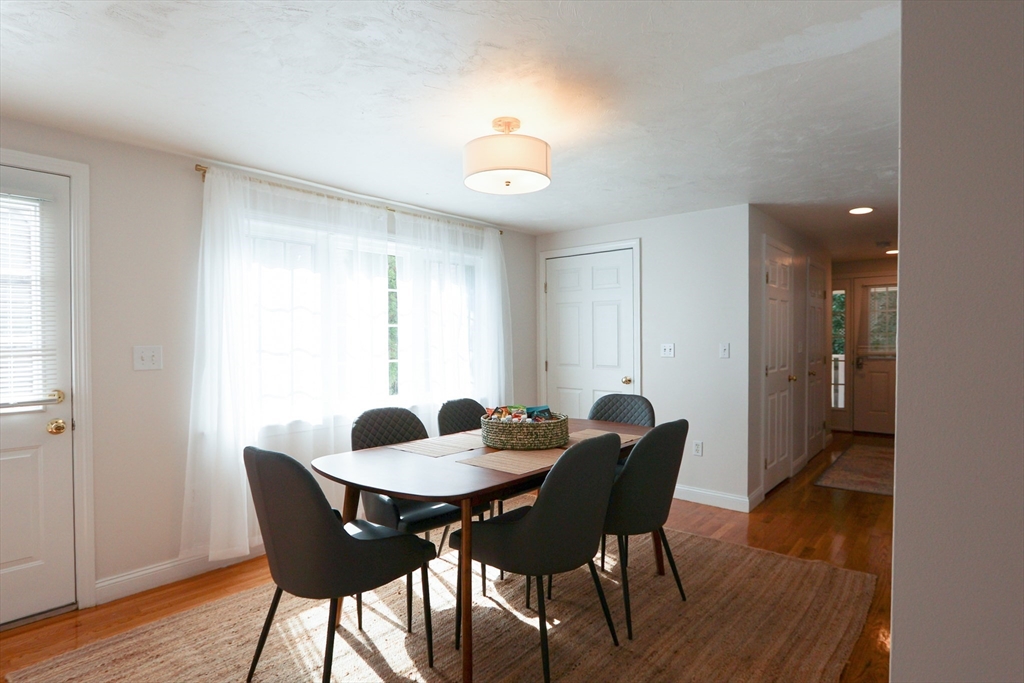 25 Jay Street, Unit FURNISHED Cambridge, MA 02139 - Photo 7 of 28 a dining room with furniture and window