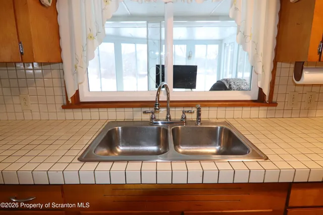 a kitchen with a sink and a window