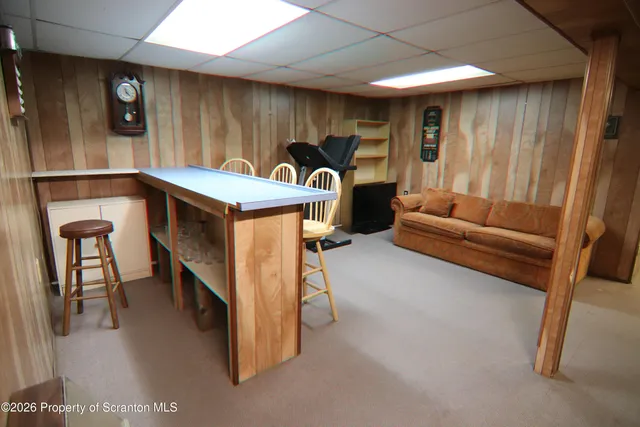 a livingroom with furniture and a window