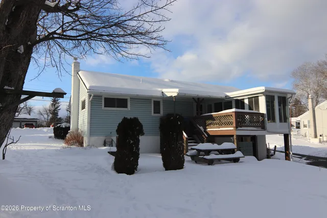 a view of a car park in front of house