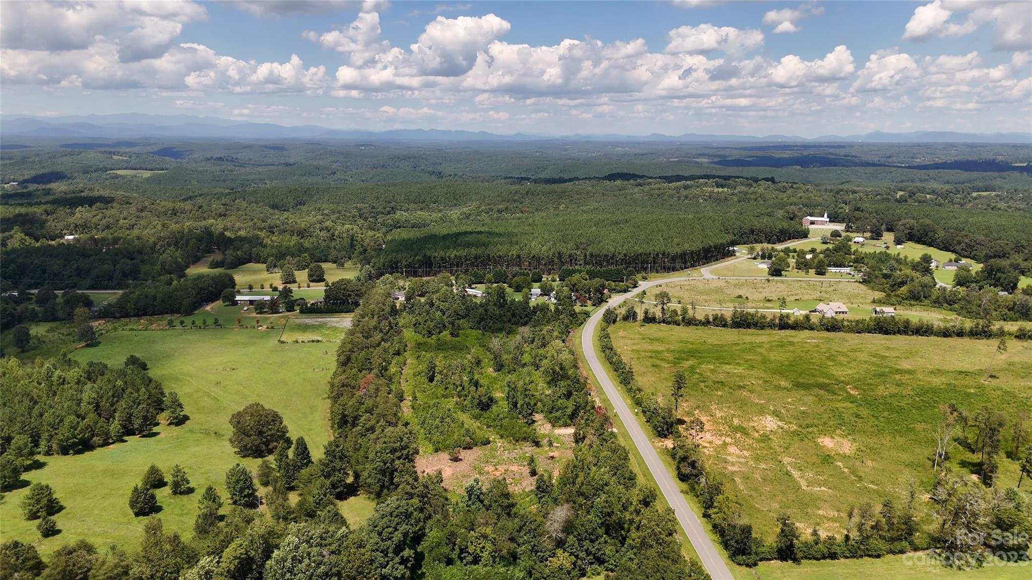 Lot 4 Poors Ford Road, Unit 4 Tryon, NC 28782 - Photo 18 of 19 a view of a lake with a houses