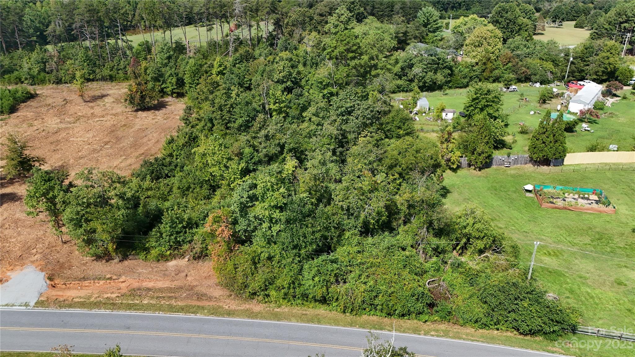 Lot 4 Poors Ford Road, Unit 4 Tryon, NC 28782 - Photo 2 of 19 an aerial view of a house with a yard