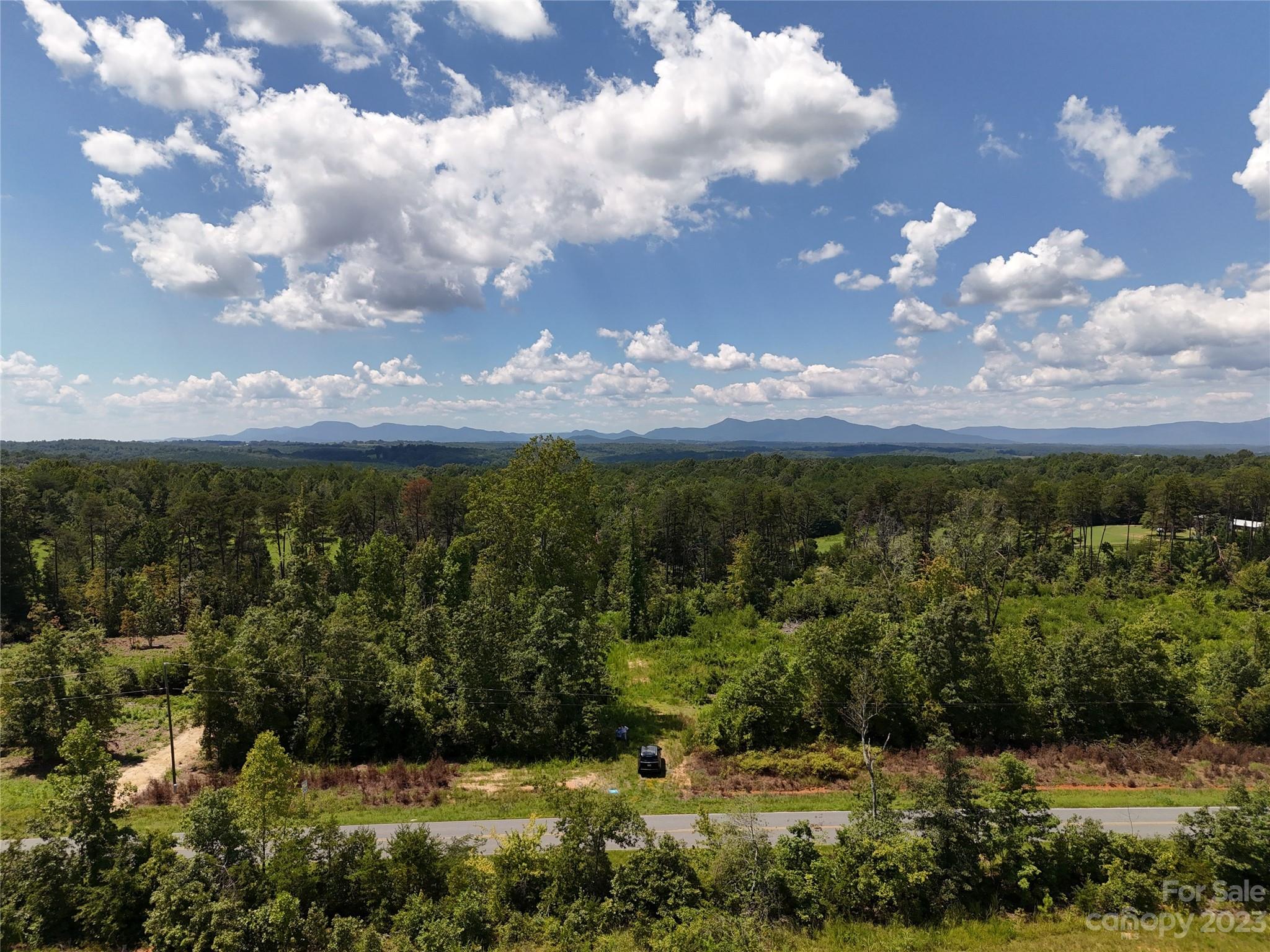 Lot 4 Poors Ford Road, Unit 4 Tryon, NC 28782 - Photo 5 of 19 a view of a lake with houses