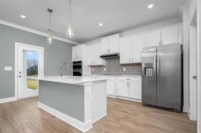 a kitchen with a sink and stove