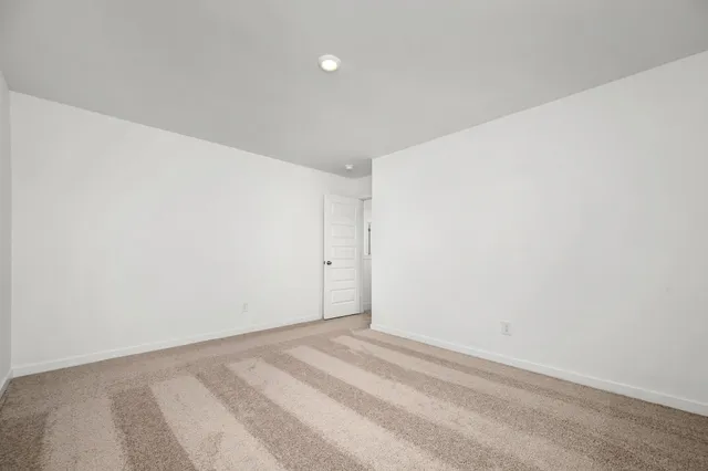 a bathroom with a toilet a sink a mirror a bathtub and vanity