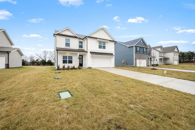 a house view with swimming pool in front of it