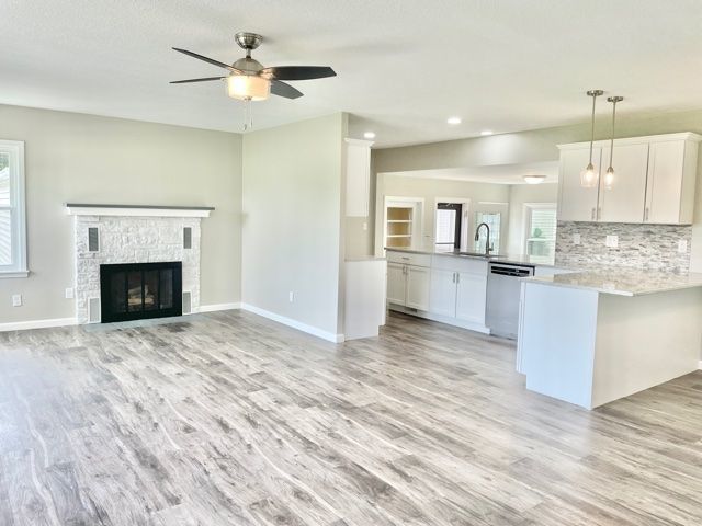 1028 Franklin Grove Road Dixon, IL 61021 - Photo 11 of 48 a view of kitchen with granite countertop cabinets and wooden floor
