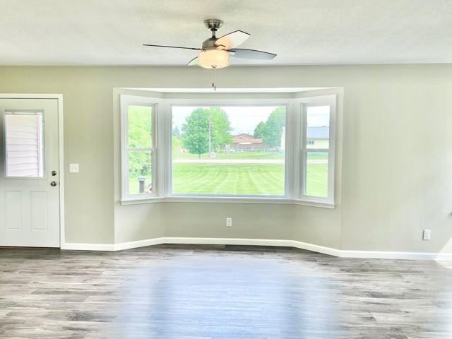 1028 Franklin Grove Road Dixon, IL 61021 - Photo 17 of 48 a view of a room with wooden floor and a window