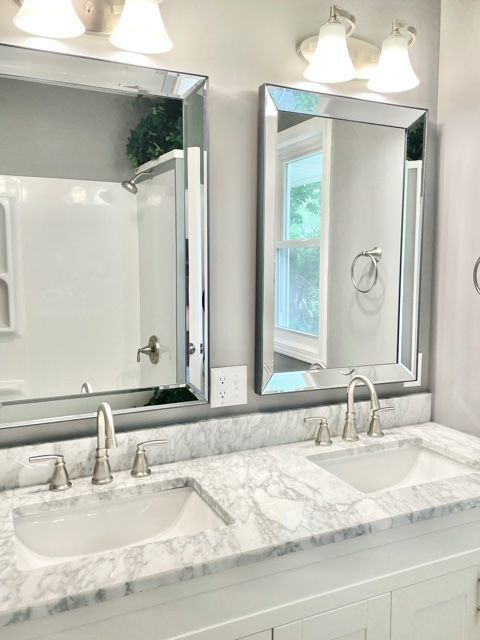 1028 Franklin Grove Road Dixon, IL 61021 - Photo 19 of 48 a bathroom with double vanity sinks and a mirror