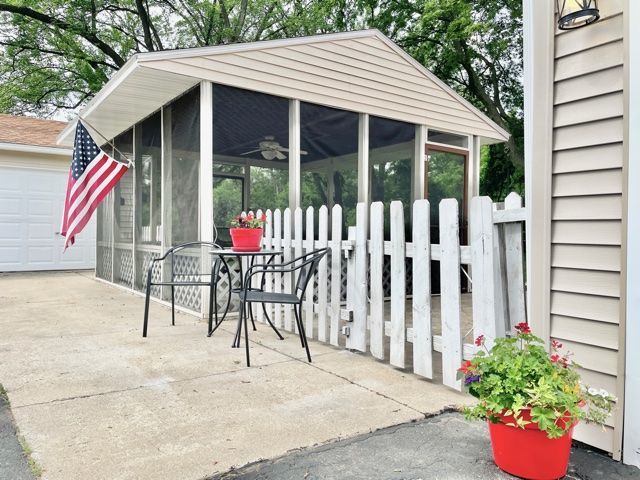 1028 Franklin Grove Road Dixon, IL 61021 - Photo 3 of 48 a view of small house with wooden floor and potted plants