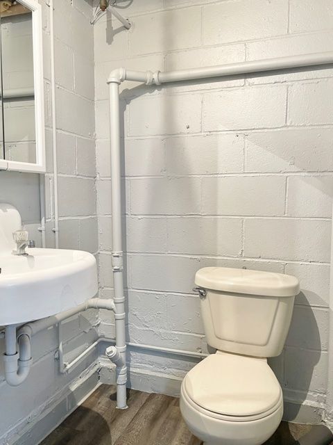 1028 Franklin Grove Road Dixon, IL 61021 - Photo 26 of 48 a white toilet sitting next to a bathroom sink