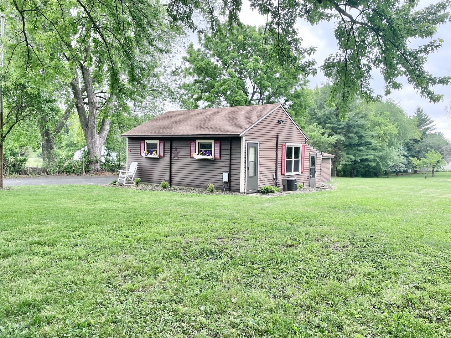 1028 Franklin Grove Road Dixon, IL 61021 - Photo 30 of 48 a front view of house with yard and green space