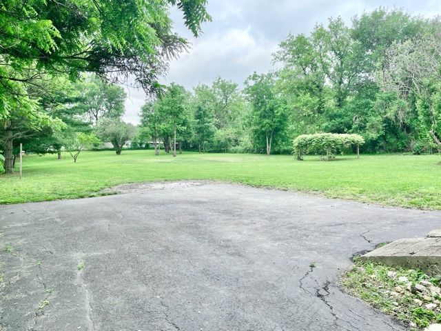 1028 Franklin Grove Road Dixon, IL 61021 - Photo 32 of 48 a view of a field and trees in the background