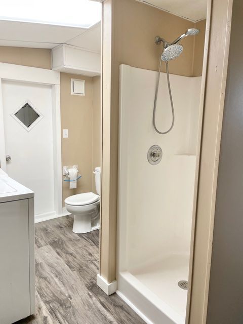 1028 Franklin Grove Road Dixon, IL 61021 - Photo 39 of 48 a bathroom with a glass shower door