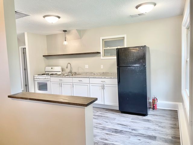1028 Franklin Grove Road Dixon, IL 61021 - Photo 43 of 48 a kitchen with stainless steel appliances a refrigerator sink and microwave