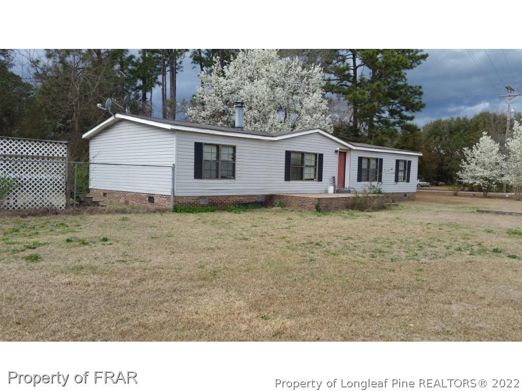 110 Tc Jones Road Raeford, NC 28376 - Photo 5 of 10 a black and white photo of a house